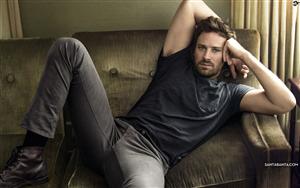 Armie Hammer, an American actor poses in a black outfit